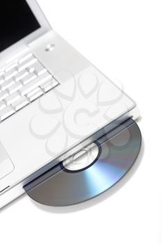 Royalty Free Photo of a CD in a Laptop
