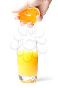 Royalty Free Photo of a Person Squeezing an Orange