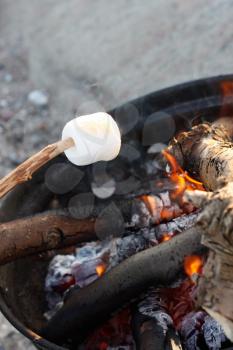 Royalty Free Photo of a Marshmallow Over a Barbecue