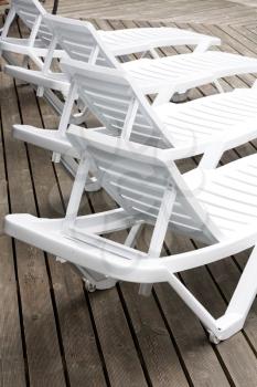 Royalty Free Photo of Chairs by the Pool