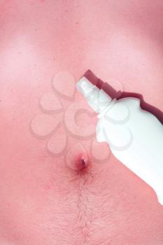 Royalty Free Photo of Sunscreen on a Man's Stomach