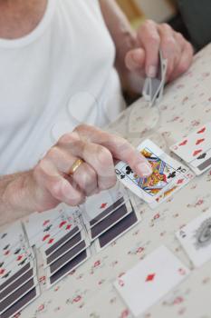 Royalty Free Photo of a Senior Playing Solitaire