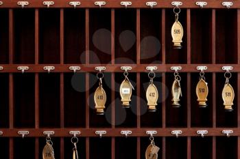 Royalty Free Photo of a Bunch of Hotel Keys in a Cabinet