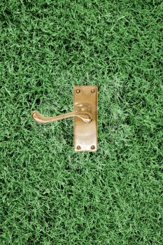 Royalty Free Photo of a Door Handle in Grass