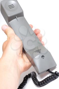 Royalty Free Photo of a Person Holding a Telephone Handle