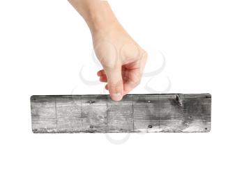 Person holding a blank piece of wood