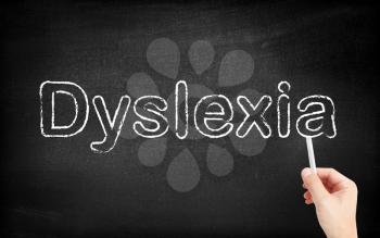 Dyslexia written on white blackboard