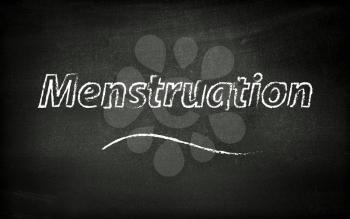 Menstruation written on blackboard