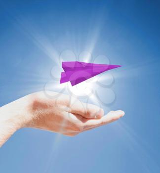 Holding a paperplane