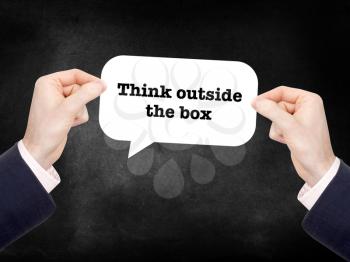 Think outside the box written on a speechbubble