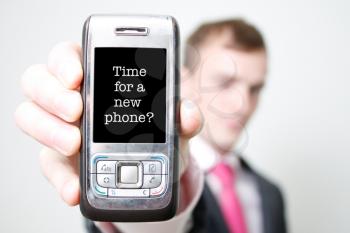Old phone held by man