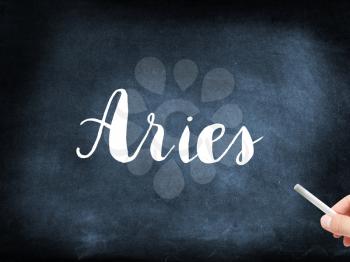 Aries written on a blackboard