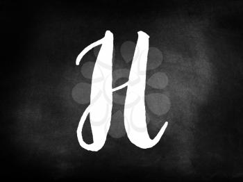 Letter H written on blackboard