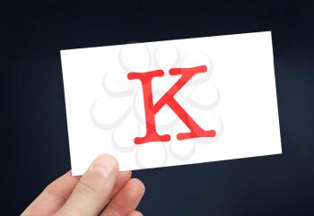The letter K on a card