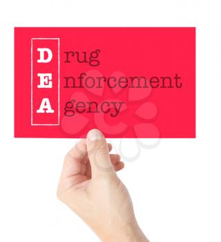 Drug Enforcement Agency explained on a card held by a hand