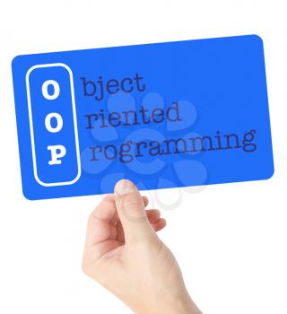 Object Oriented Programming explained on a card held by a hand