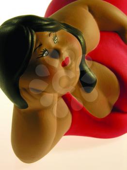 Royalty Free Photo of a Figurine of a Chubby Woman