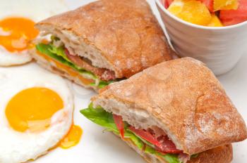 Royalty Free Photo of a Ciabatta Sandwich with Fruit and Eggs