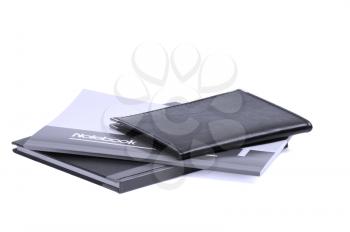 assorted notebooks flat piled on white background,blue filter