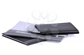 assorted notebooks with a cd flat piled on white background,blue filter