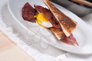 eggs sunny side up with bacon and toast typical english breakfast
