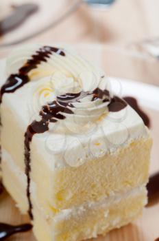 fresh cream cake closeup with chocolate sauce topping 