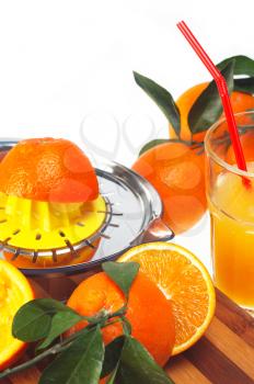 making fresh orange juice over white