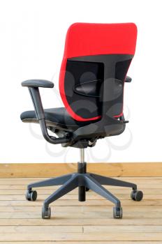 modern red office chair on wood floor over white background