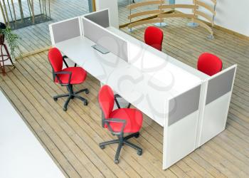 office desks and red chairs cubicle set view from top over wood flooring 