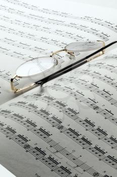 percussion and drums music charts with glasses on top