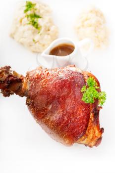 original German BBQ pork  knuckle served with mashed potatoes and  sauerkraut isolated on white ,MORE DELICIOUS FOOD ON PORTFOLIO