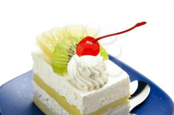 piece of fresh fruit cake on white background