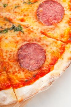 Italian original thin crust pepperoni pizza extrene close up