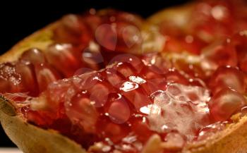 dettail close up of a pomegranate fruit open in half