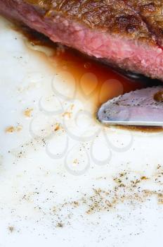 fresh juicy beef ribeye steak grilled sliced on a plate