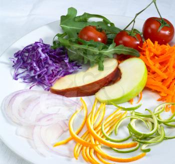 fresh salad ingredient prepared cutted on a plate 