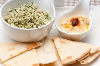 fresh traditional arab taboulii couscous with hummus