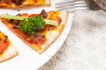 Royalty Free Photo of a Turkish Beef Pizza With Cucumber and Parsley