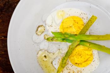 boiled fresh green asparagus and eggs with extra virgin olive oil
