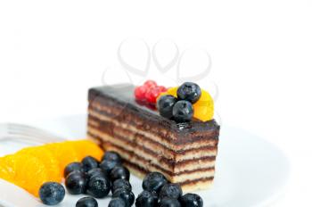 chocolate cake and fresh fruit on top closeup macro