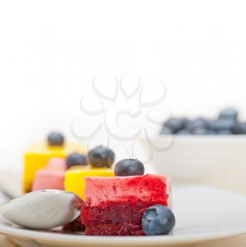 fresh strawberry and mango mousse dessert cake with blueberry