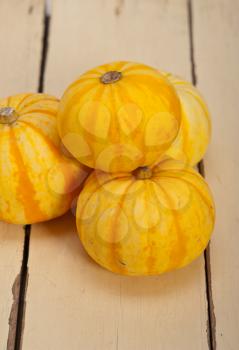 bunch of fresh yellow pumpkins just collected from garden 