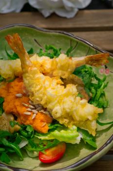 fresh deep fried Japanese tempura shrimps with salad and sea urchin 