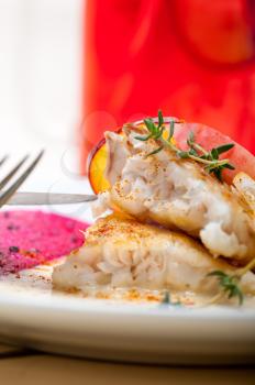 sea bream orata  fillet butter pan fried with fresh peach prune and dragonfruit slices thyme on top