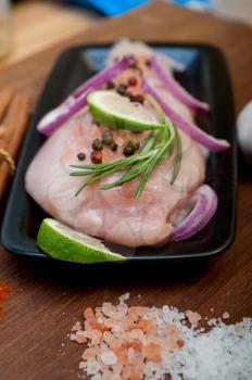 fresh organic chicken breast with herbs and spices