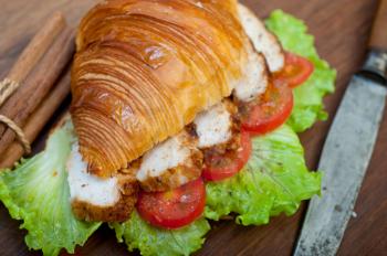 savory croissant brioche bread with chicken breast and vegetable rustic style 