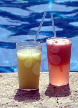 Royalty Free Photo of Drinks by a Pool