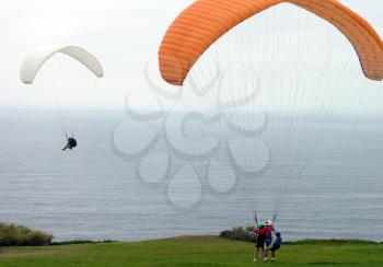 Royalty Free Photo of Two Paragliders by the Ocean