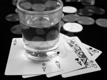Royalty Free Photo of a Shot Glass and Cards