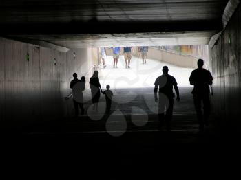 Royalty Free Photo of People Walking in a Tunnel
